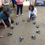 Particpants arranged the robots in a circle and watched them all be controlled by the infrared signal from a Sony remote.