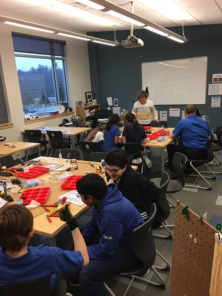 Gisele Mentoring Students at World Academy Kit Build