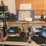 W1AKI Field Day - Desk with IC-7300 and laptop.; ooks, old linear power supply, other xvcrs in background