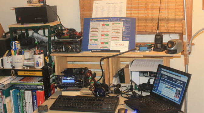 W1AKI Field Day - Desk with IC-7300 and laptop.; ooks, old linear power supply, other xvcrs in background